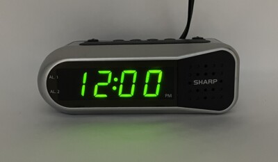 Sharp Digital Small Alarm Clock LED Display Battery Backup Snooze Model SPC100