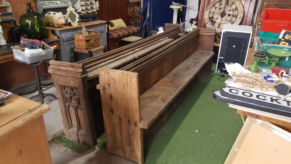 Antique pair of church pews with carvings in Salisbury, Wiltshire