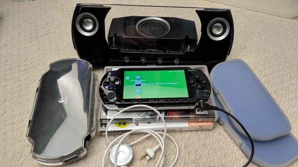 Sony PSP 1003 2 games, 1Gb SD card, Logic3 Speakers, remote control