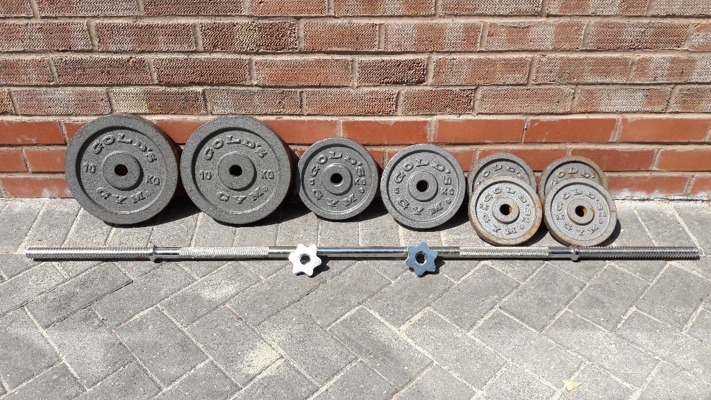 GOLDS GYM CAST IRON WEIGHTS SET WITH LONG BARBELL in Walsall, West