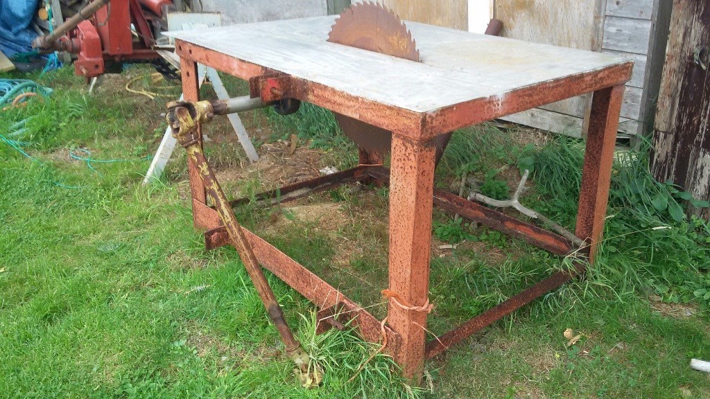 Firewood Bench Saw. PTO driven. Old though cuts fine. 3 point tractor