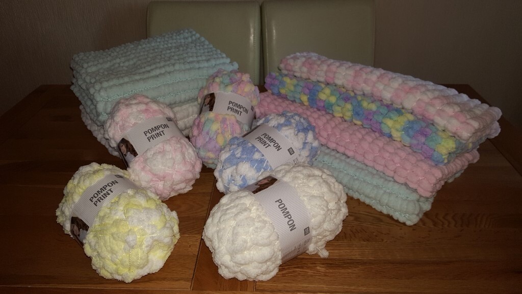 Knitted baby pram blanket in pom pom wool. Various colours. Length 70cm