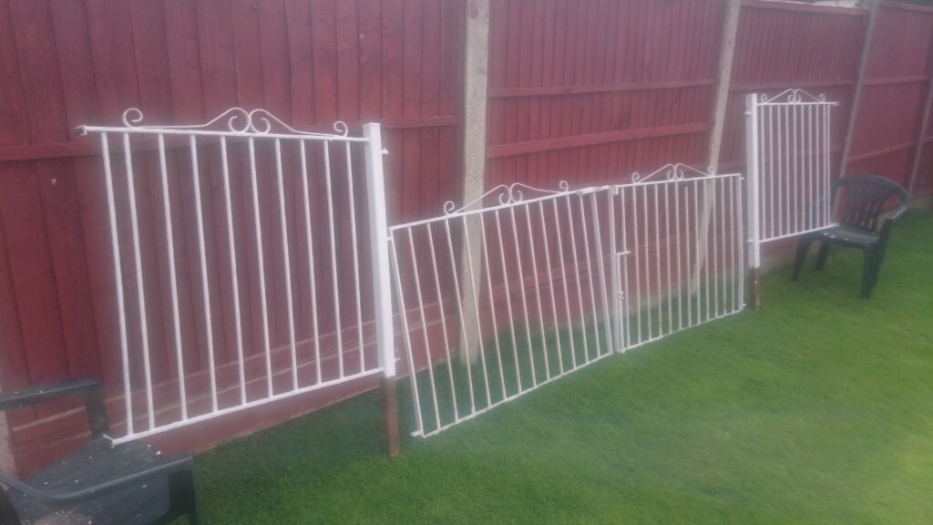 White metal garden/driveway gates with side panel infills in