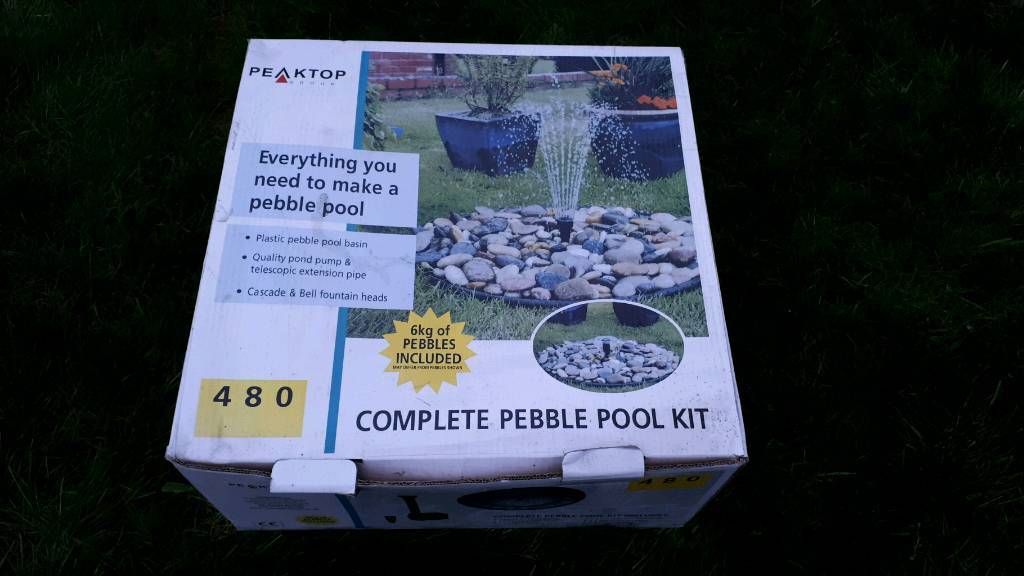 Pebble fountain water feature kit with reservoir and pump in West