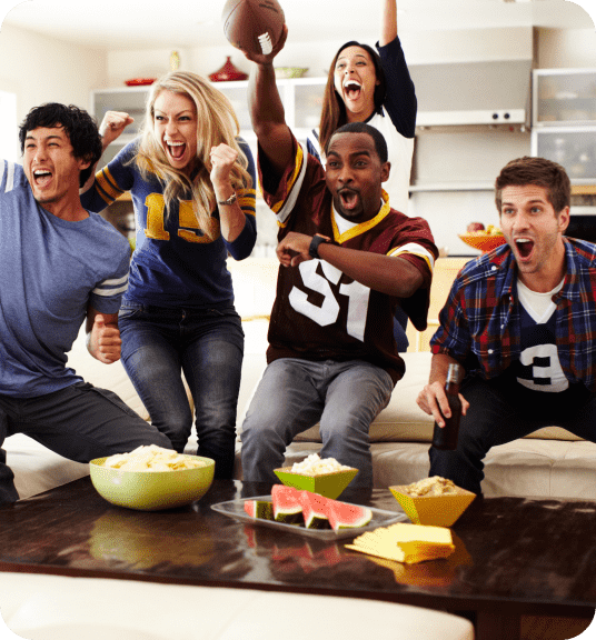 Friends wearing football jerseys and cheering linking to sports memorabilia