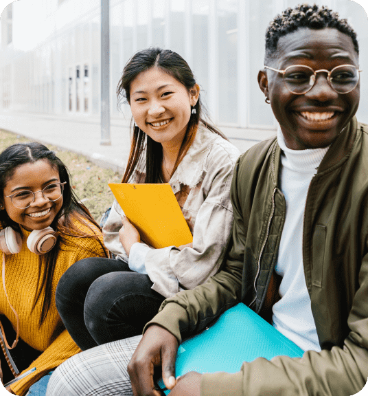 A group of people smiling holding folders linking to Back to University page