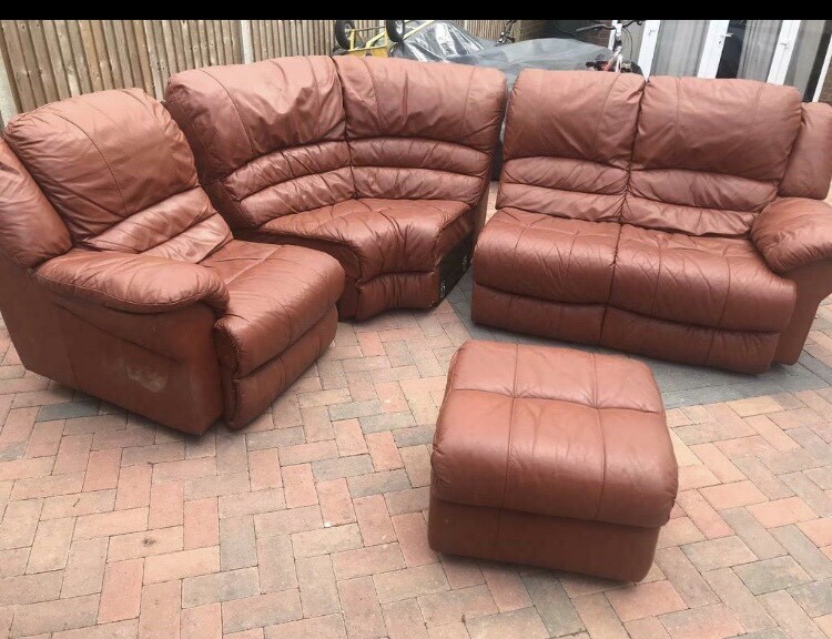 Brown leather curved corner sofa with footstool in Luton