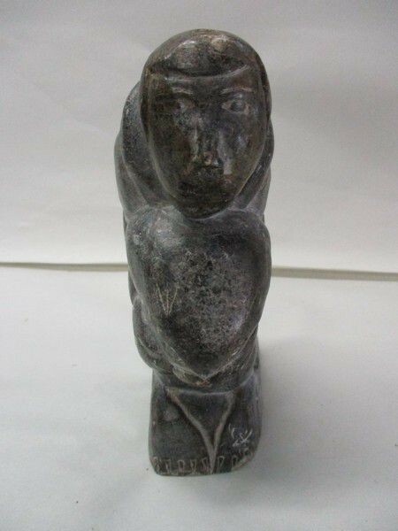 Vintage Inuit Soapstone Carving Depicting Hunter with Seals