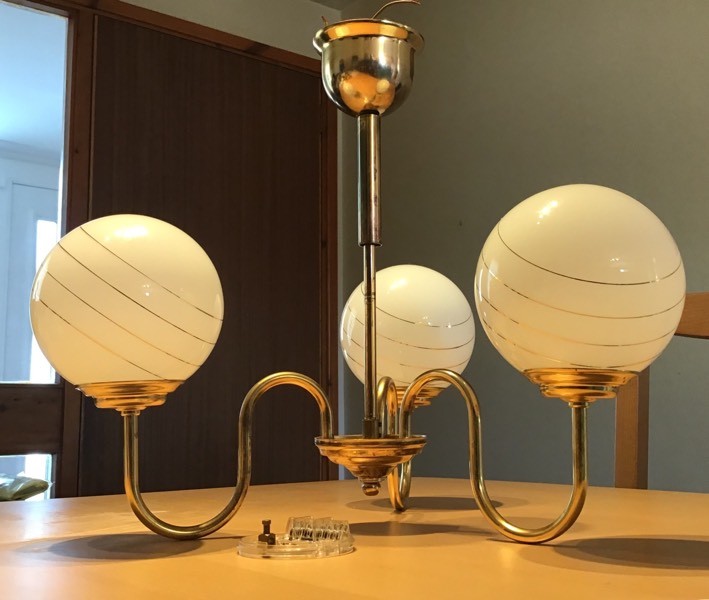 Globe light fitting. Brasscoloured with 3 white globes in Portlethen