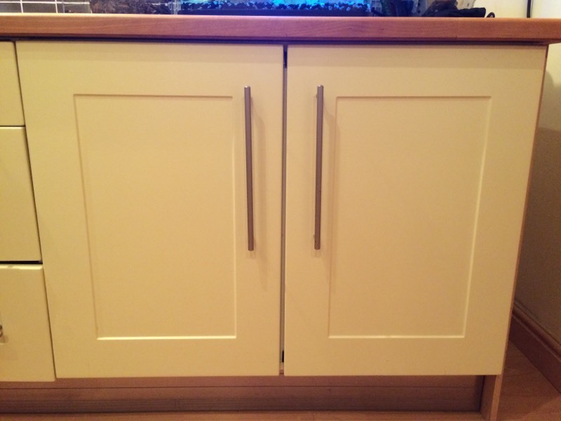 Pale lemon B&Q shaker kitchen cupboard doors, draw fronts, wall carcasses. Handles & hinges too ...