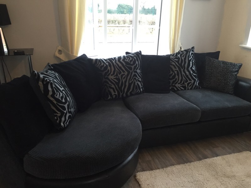DFS Sofa for sale with Swivel Chair and Footstool black leather and