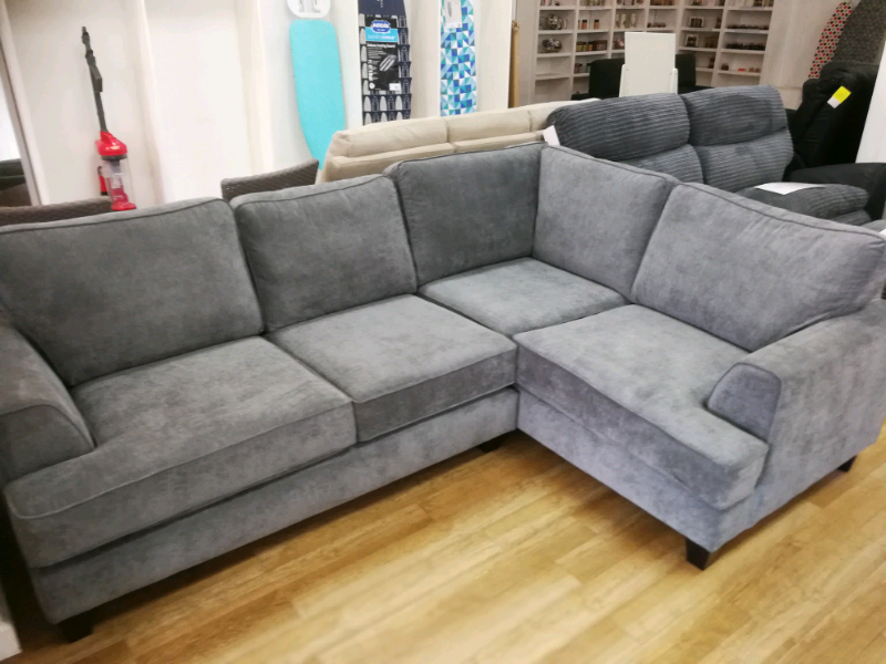 Grey fabric corner sofa with wooden legs in Hamilton, South