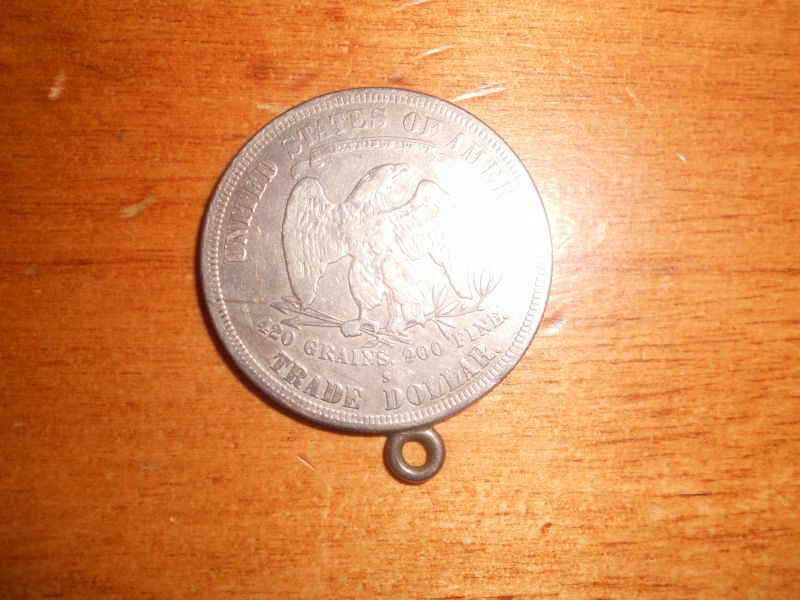 1877 seated Liberty Silver trade dollar coin ungraded with attached loop