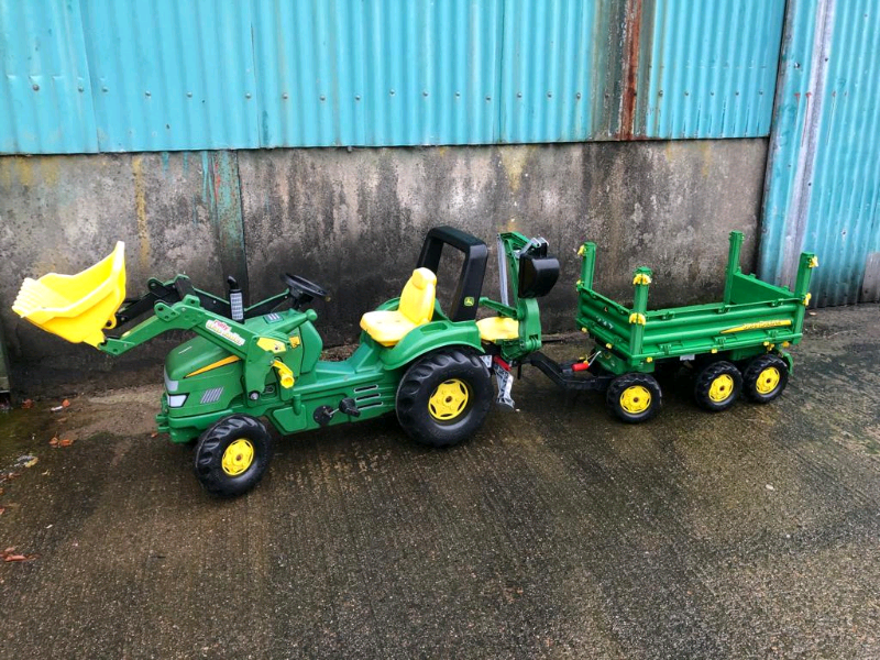 Large rolly John dear tractor with front loader an back digger trailer