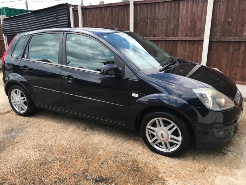 FORD FIESTA GHIA 2006 REG IN BLACK WITH LEATHER SEATS AIR CON & HEATED ...