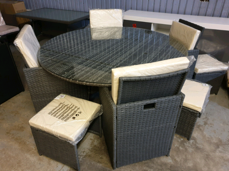 A new round garden rattan dining table 4 x chairs 4 x puffees. | in