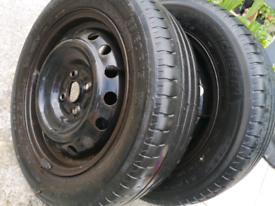 A pair of Mitchelin energy tyres with wheels 