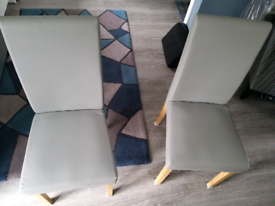 2 Grey faux leather dining chairs