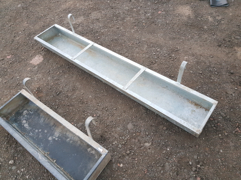 Selection of galvanised hang on feed troughs farm livestock tractor
