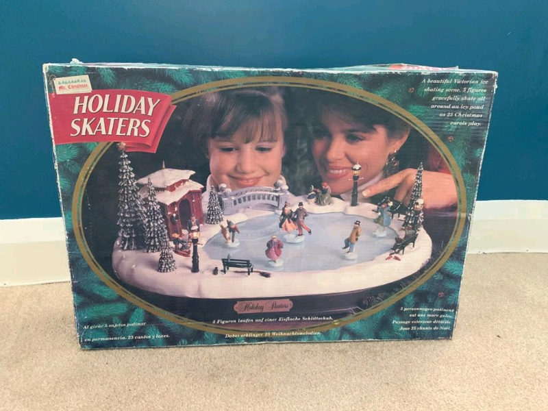 Ice Skating Christmas village with rotating skaters in Penylan