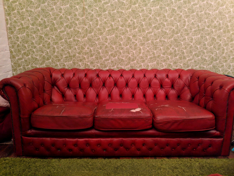 Red chesterfield sofa, ripped cushions in Brick Lane, London Gumtree