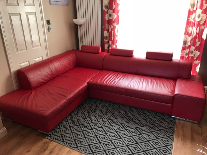 small red leather corner sofa