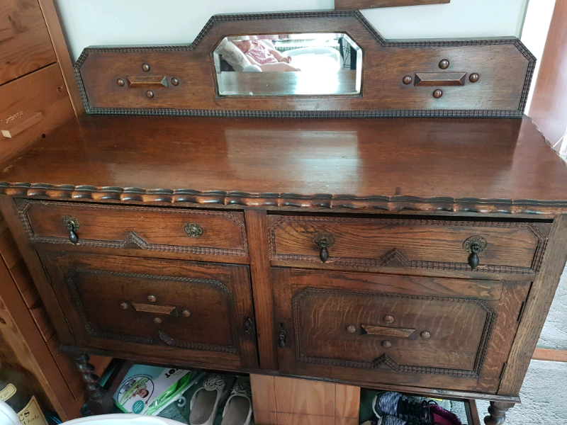 Dark wood antique sideboard in BourtonontheWater, Gloucestershire