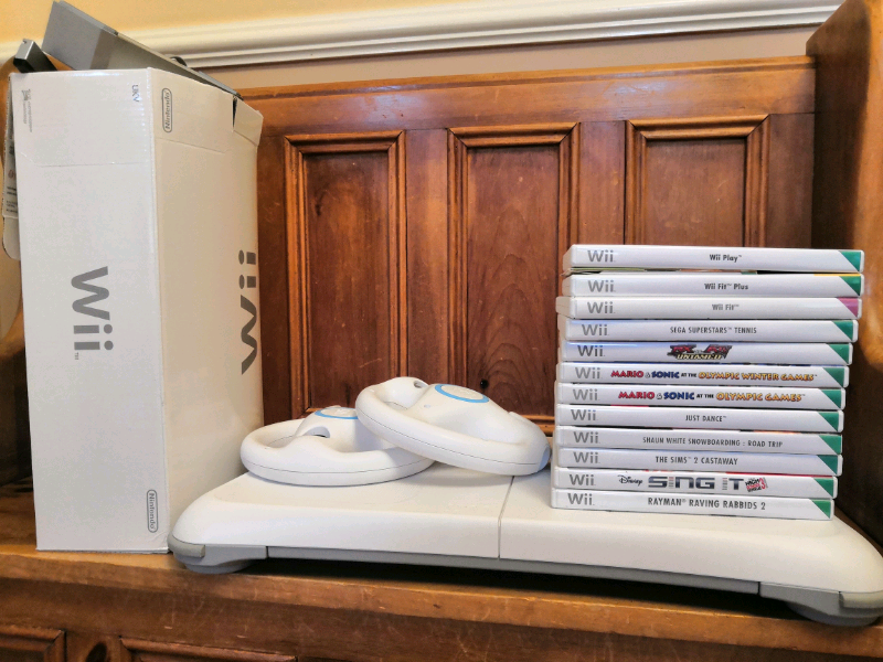 Nintendo wii with games, remotes, wires, wii board and steering wheels in Norwich, Norfolk