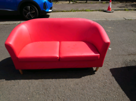 36. Red leather 2 seater tub chair 