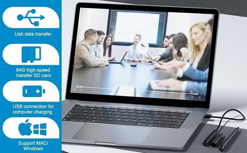 Laptop with USB features advertisement, business meeting in background.