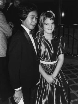 Ke Huy Quan Drew Barrymore attends the Youth Film Awards US 1985 Old Photo