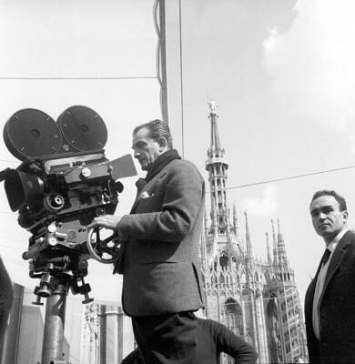 Italian director Luchino Visconti shooting a scene of the film Roc- Old Photo