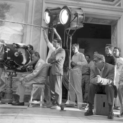 Italian director and scenarist Luchino Visconti sitting at the cam- Old Photo