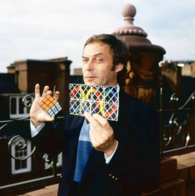 Erno Rubik poses two of inventions Rubik's Cube Rubik's Magic Lond- Old Photo 1