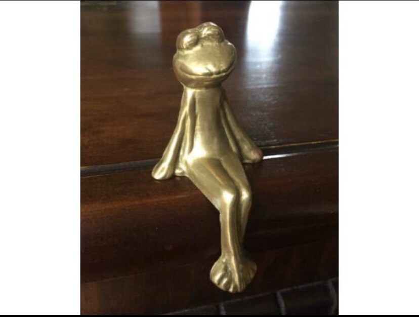 Vintage Brass Frog Ornament Sits on Ledge in Blackhall, Edinburgh
