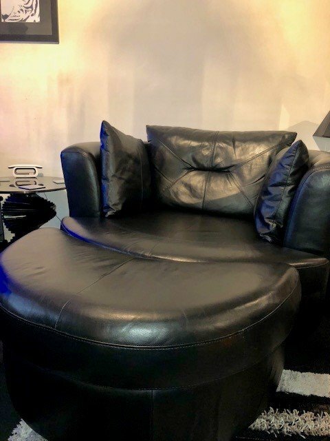 DFS Large Black Leather Swivel/Cuddle Chair &amp; Half Moon Footstall | in