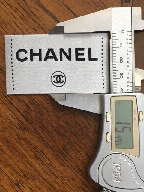 One Replacement Chanel clothing label, tag, color white 