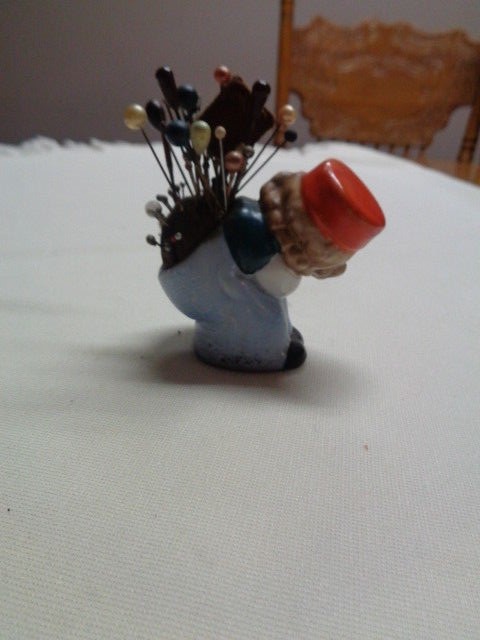 VINTAGE PORCELAIN BENDING GIRL PIN CUSHION MADE IN JAPAN IN GOOD CONDITION