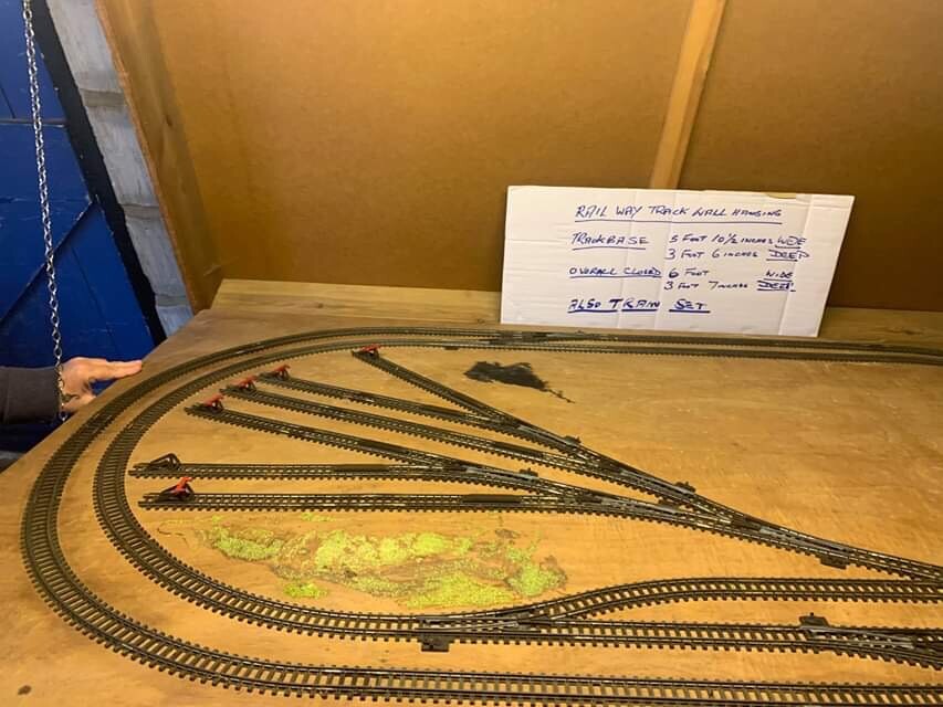 Wall mounted train track table and various hornby trains in Wakefield