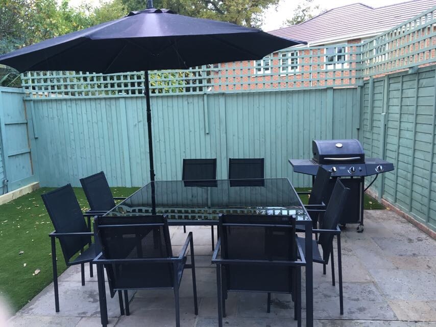 Garden furniture chairs, table, parasol and BBQ in Lightwater, Surrey