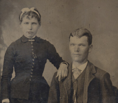 PORTRAIT OF YOUNG WELL-DRESSED COUPLE W/ LIGHT EYES