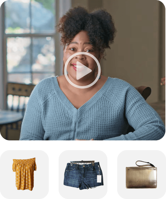 A white play button icon over a person smiling linking to a Youtube video