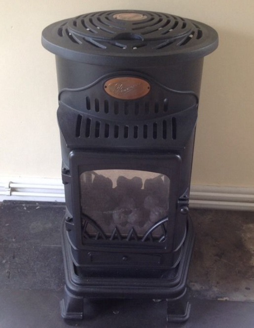 cast iron wood burner effect calor gas stove with bottle in Toxteth