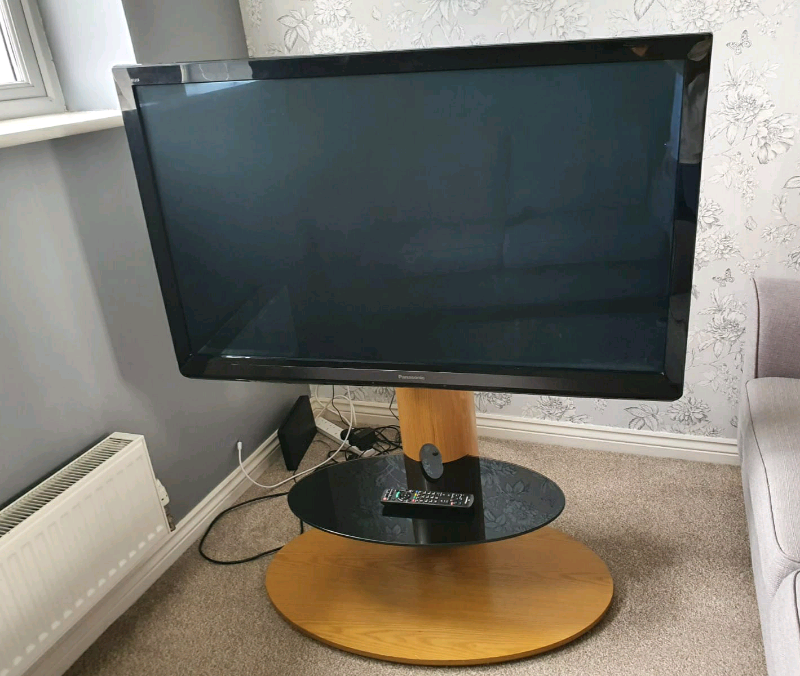 Panasonic 50 inch tv with oak stand and Panasonic theater system in