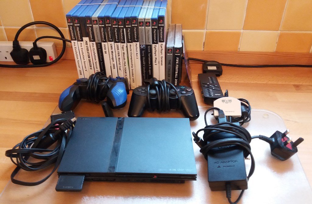 Sony PS2 Mini Slim Console with accessories and games in Seaton