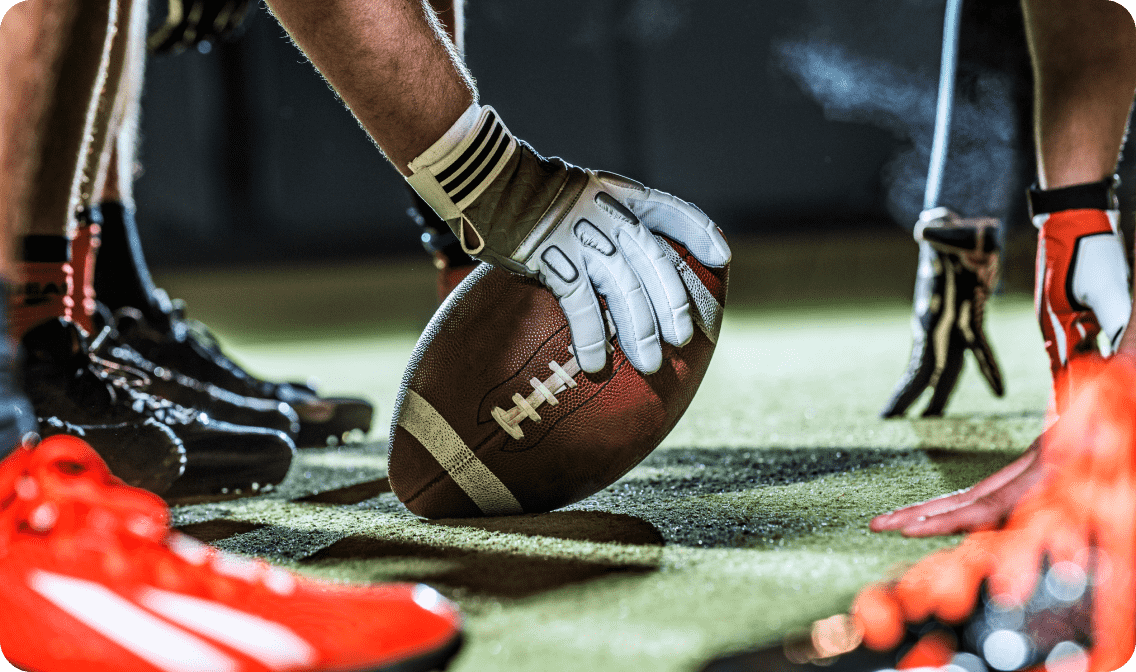 Hand holding football