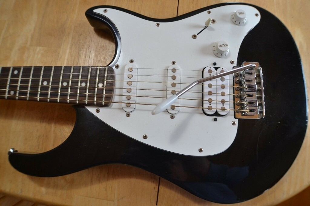 Peavey Raptor EXP Electric Guitar, gig bag and leather strap in