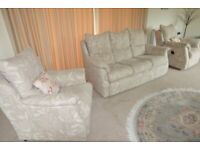Three piece suite with electric reclining chair