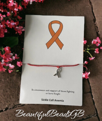 In awareness and support of sickle cell Anemia wish bracelet red ribbon charm