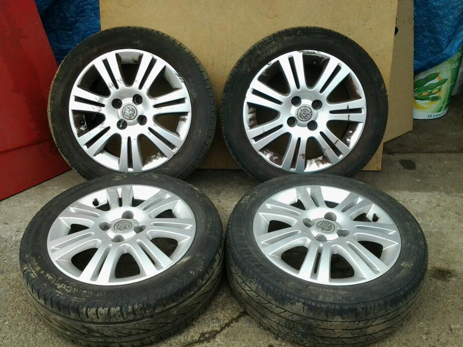 Vauxhall corsa d 15 inch 4 stud sxi alloy wheels centre caps and tyres